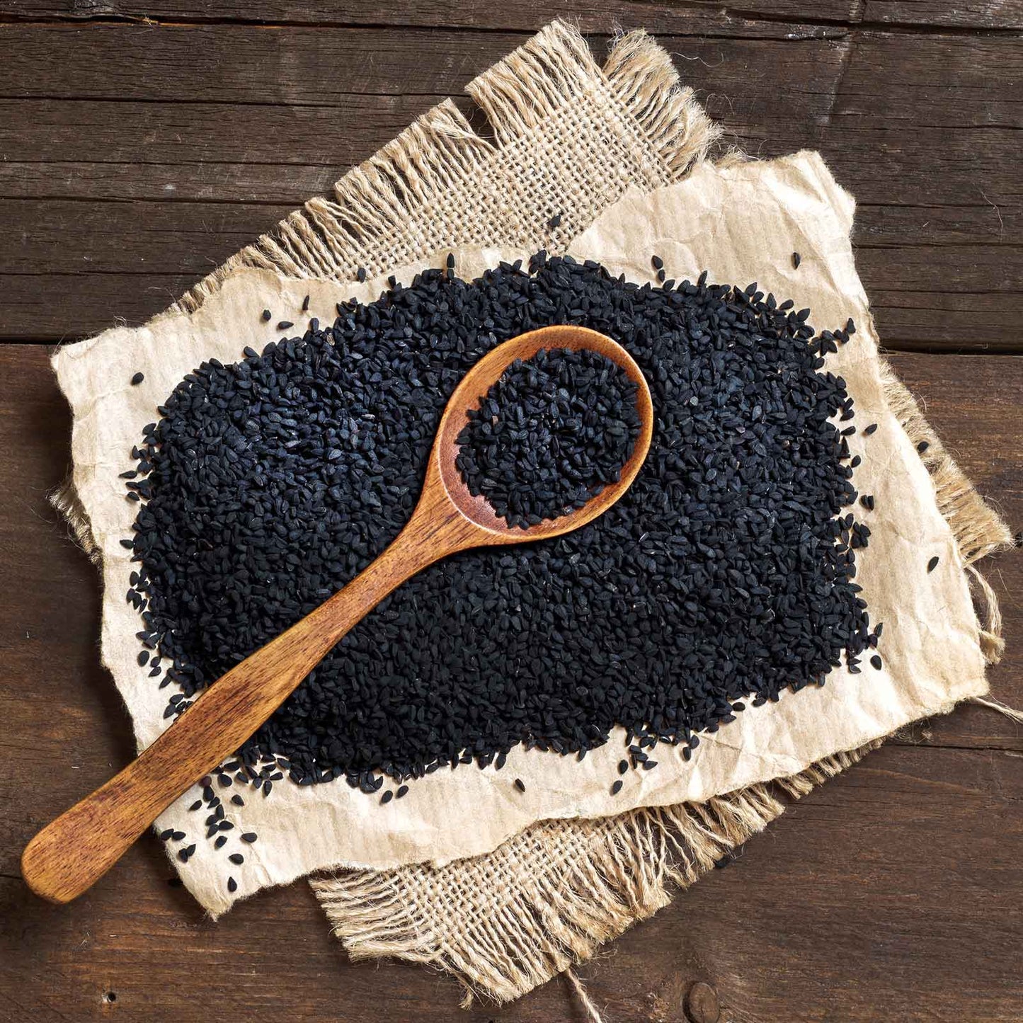 A shot of small, black, oval-shaped cumin seeds, perfect for adding a bold flavor to your dishes.