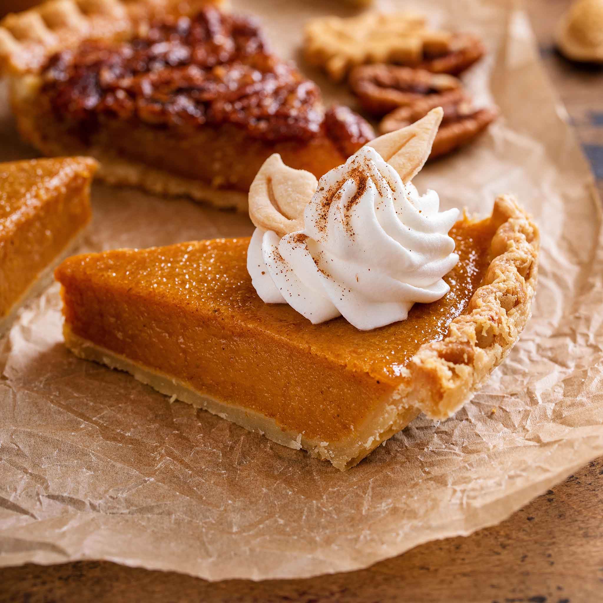 A slice of Kentucky Field pumpkin pie with a dollop of whipped cream.