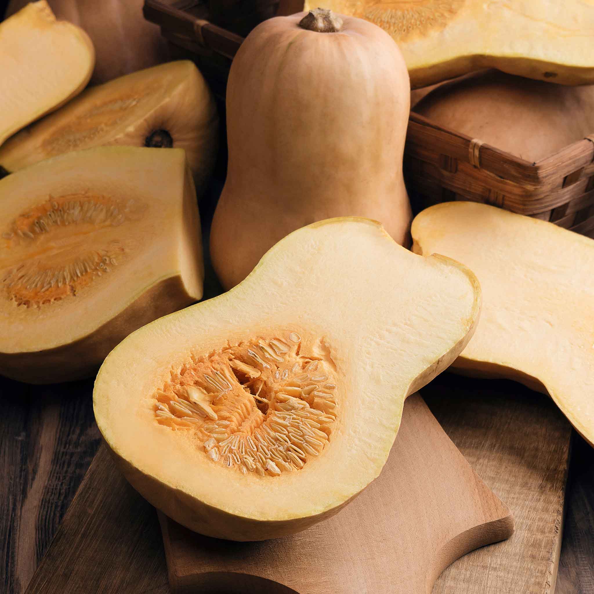 A cross section of a Honeynut squash showing flesh and seeds.