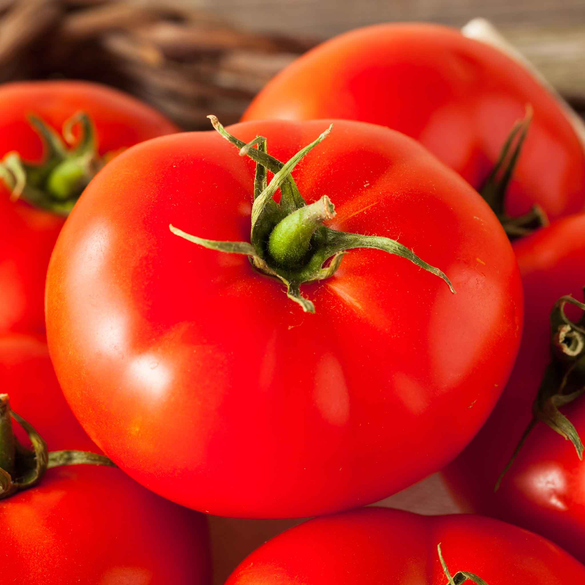 A pile of beefmaster tomato, showing its smooth skin.