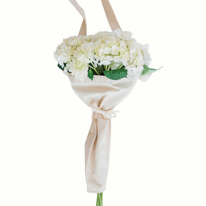 White flowers in the bouqbags gifting tote with strap on a white background