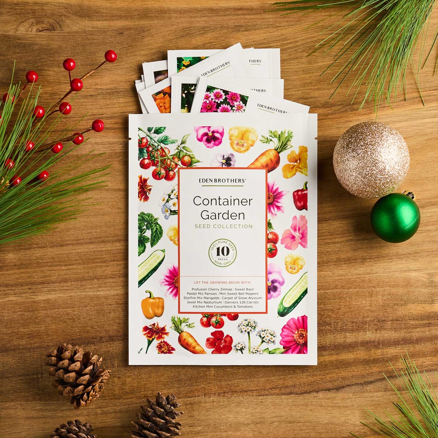 Eden Brothers Container Garden Seed Collection packaging on a wooden surface with decorative elements.