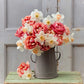 Bouquet of red and white spring cheer daffodil and tulip bundle in a metal vase.