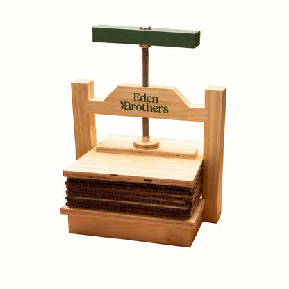 Large Wooden Flower Press with the Eden Brothers logo with cardboard in the press.