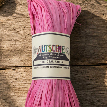 A bundle of the english rose nutscene madagascan raffia with nutscene label on a wooden background