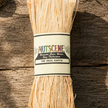 A bundle of the natural nutscene madagascan raffia with nutscene label on a wooden background