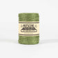 Green twine spool with Nutscene label on a white background