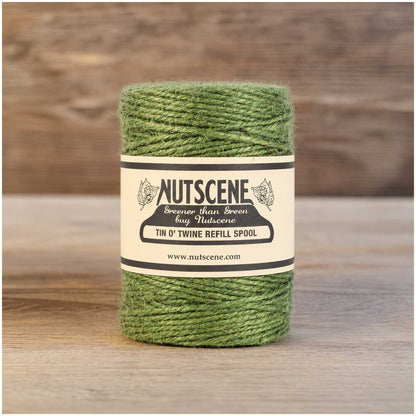 Green twine spool with Nutscene label on a white background