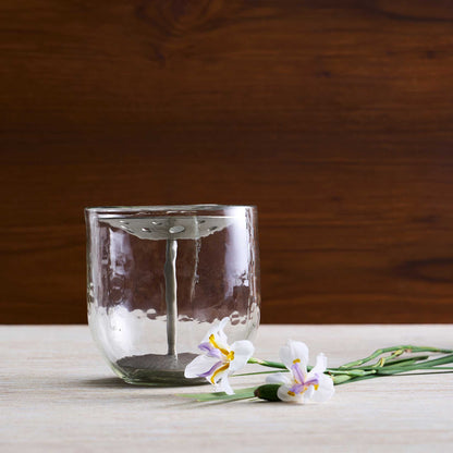 The collective pebbled vase and flower frog shown without a bouquet to give a clear image of the product