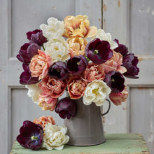 Bouquet of peach, purple, and white antique noir tulip bundle in a metal vase.