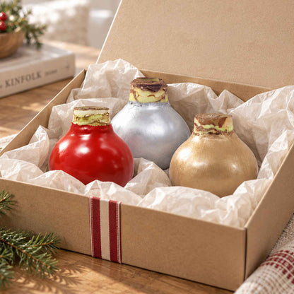 Gift box containing the waxed amaryllis holiday 3 pack with red, silver, and gold waxed bulbs.