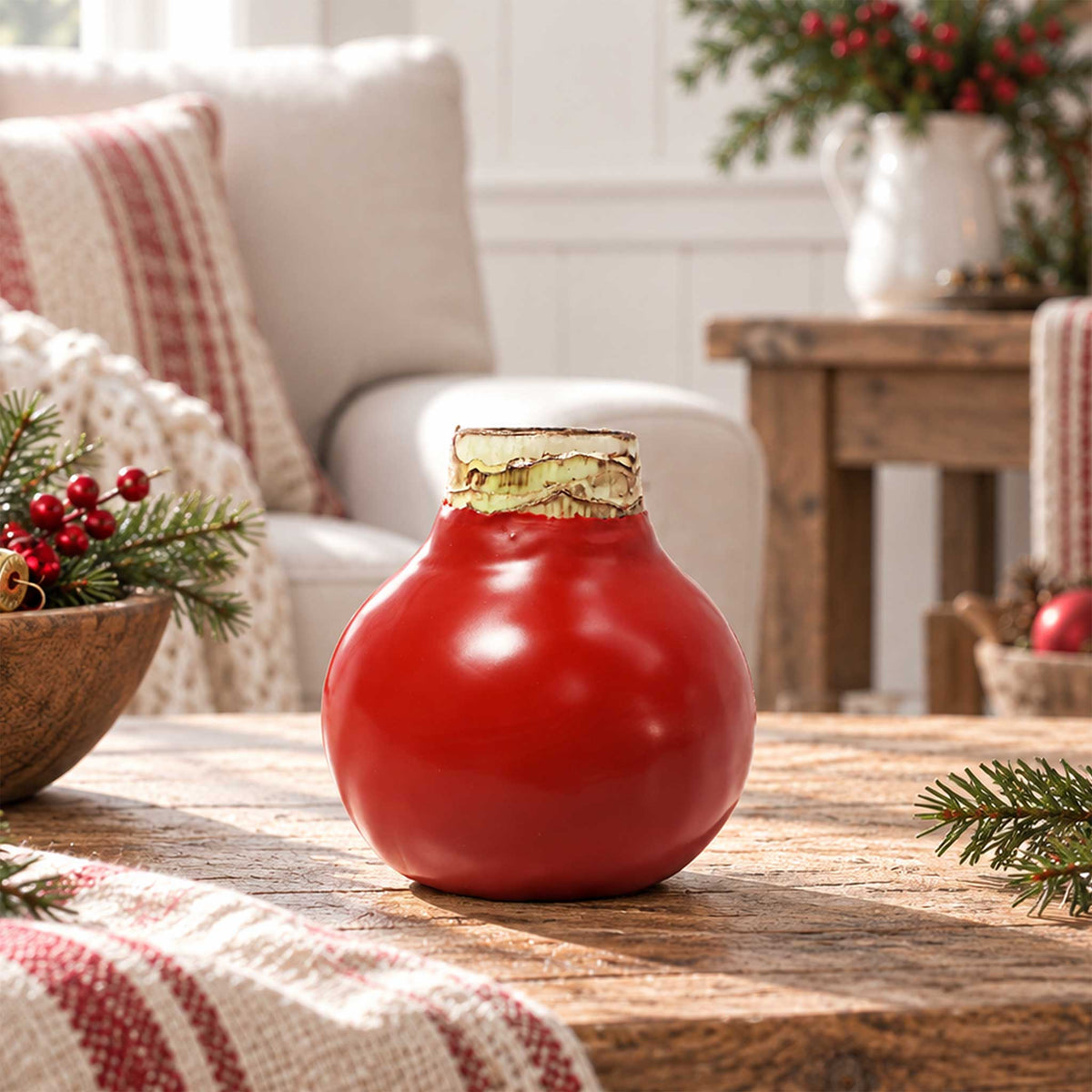 Red wax amaryllis bulb with red blooms in an indoor setting showing only the bulb