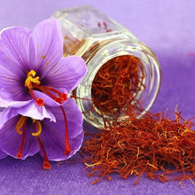 A Saffron Crocus flower with a jar of harvested saffron spilling out.